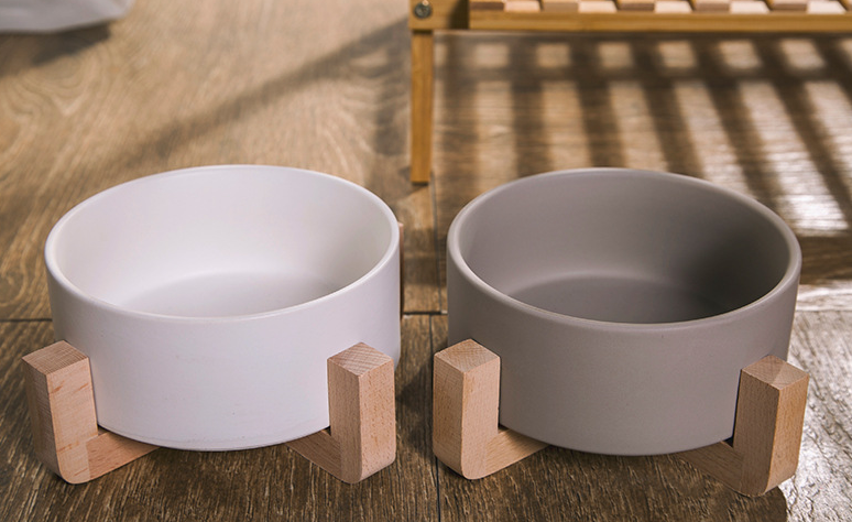 Elevated ceramic pet bowl with wooden stand
